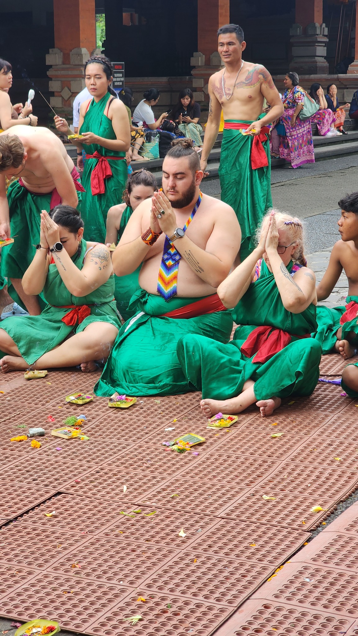 Retreat guests taking part in a Balinese water ceremony