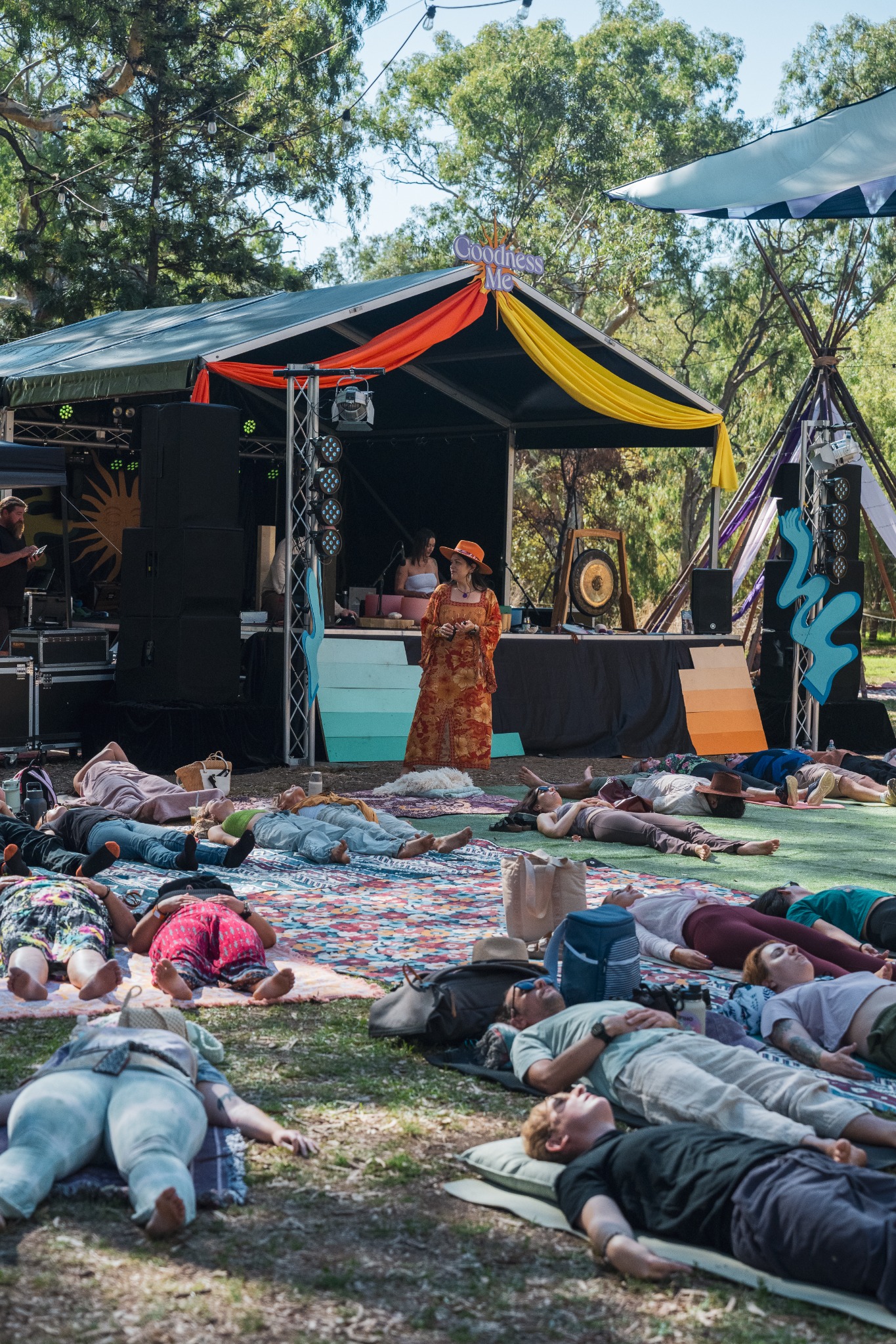 A facilitator holding space for the Goodness Me festival crowd
